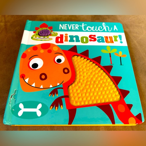Never touch a Dinosaur-touch & feel board book written by Rosie Greening - Picture 1 of 3